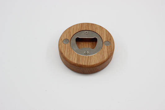 Solid oak puck bottle opener showing stainless steel opener insert