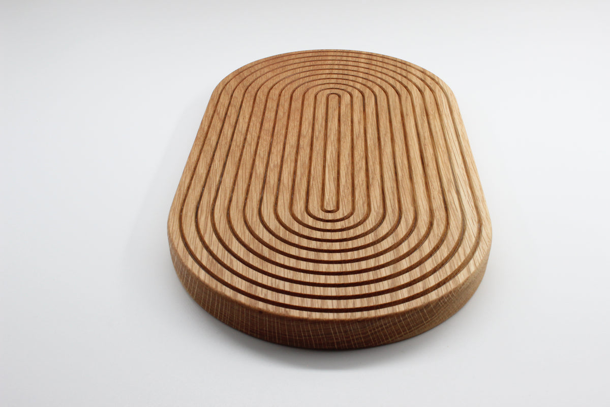 Rounded solid oak grooved trivet