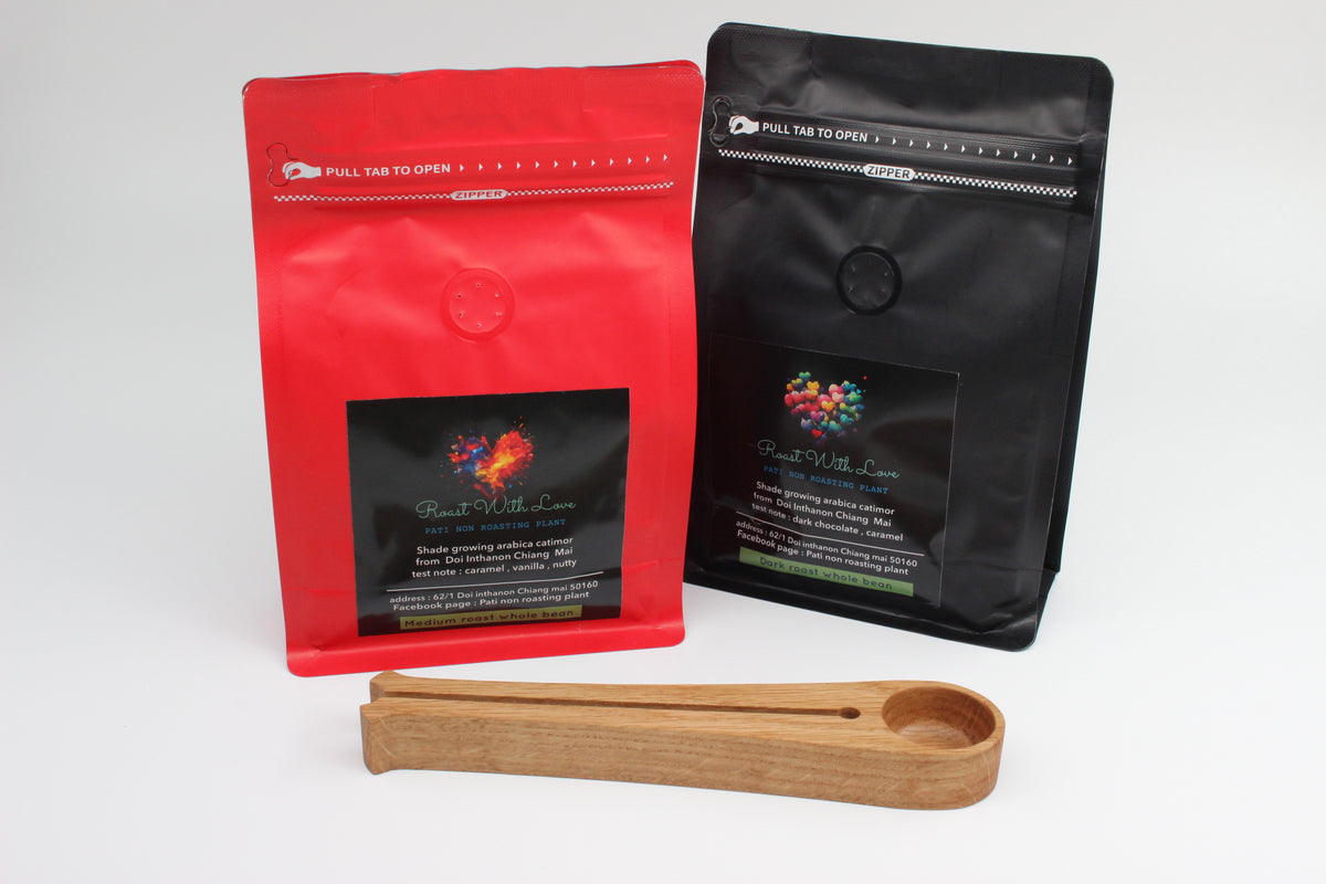 Wooden coffee scoop and bag clip with coffee packaging