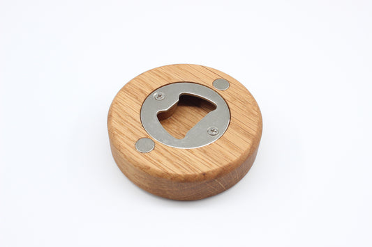 Solid oak puck-style bottle opener with stainless steel insert